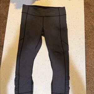 Charcoal chevron Lululemon leggings with pockets, drawstring and mesh detail